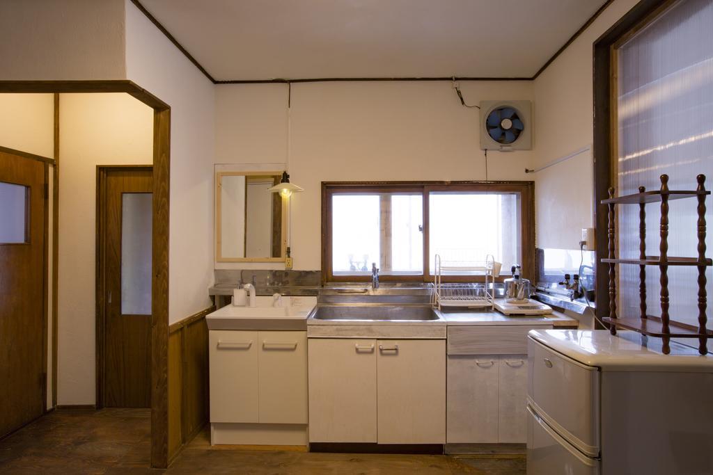 Guest House Sato Shoten Toyoura Bagian luar foto